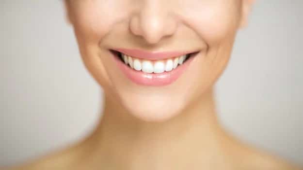 A person with a bright, radiant smile showcasing the effectiveness of at-home teeth whitening in Decatur, GA.