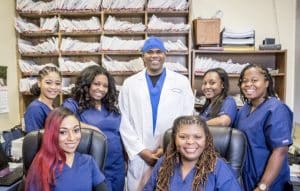 A group of people with bright smiles, happy and satisfied after receiving dental care at Metro Decatur Dental Group.